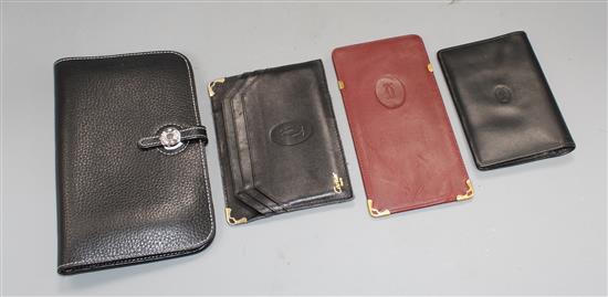 A Hermes leather filofax case, a Cartier leather passport holder, card holder and spectacle case